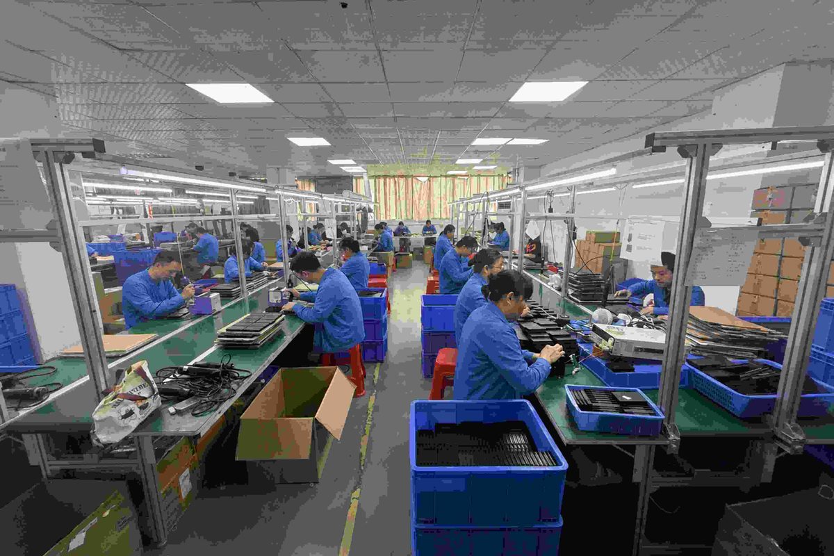 factory-workers-blue-uniform-assembly-line